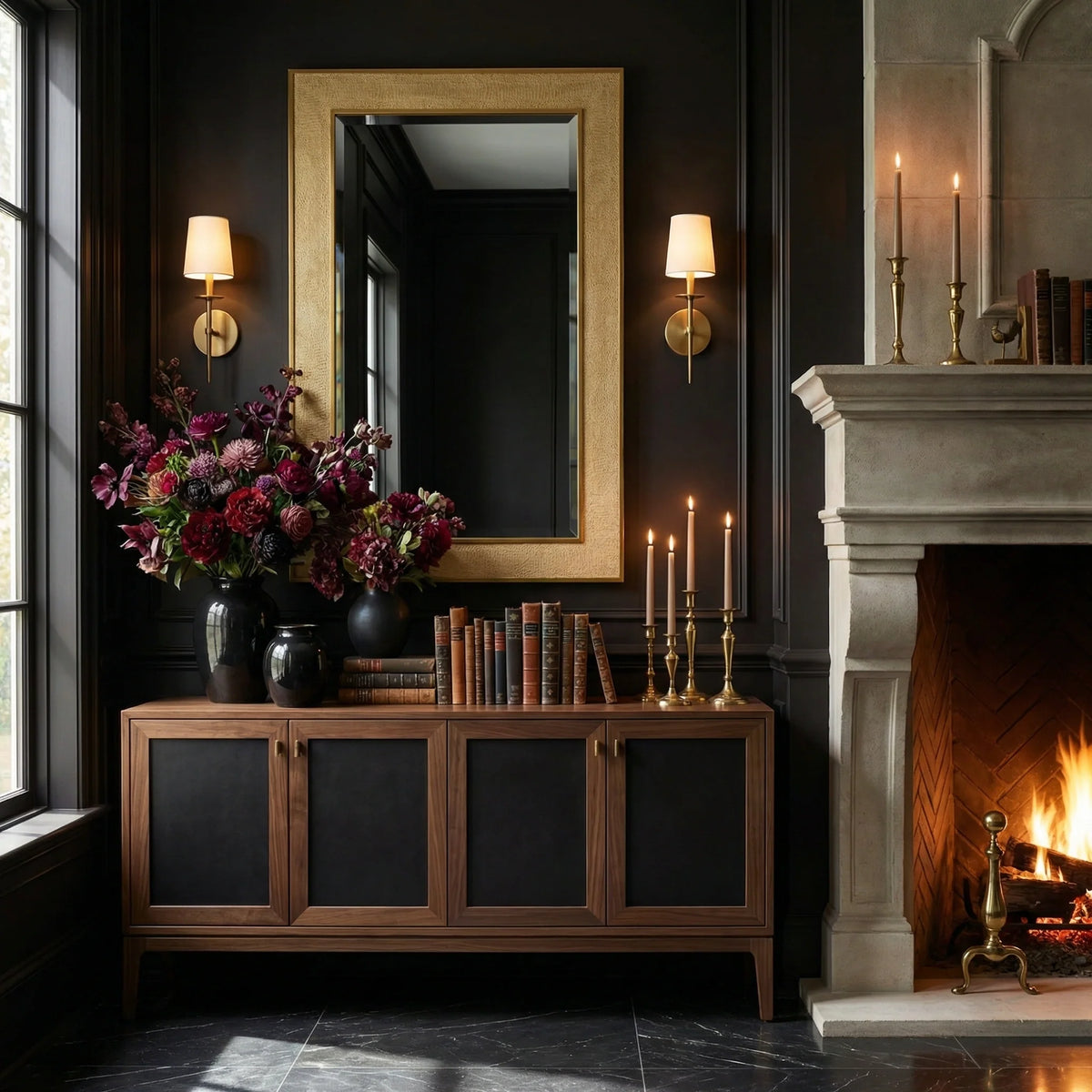 Luxury interior with Ambella Home Collins clear beveled mirror, faux crocodile skin frame and brass trim, displayed above a credenza beside a fireplace.