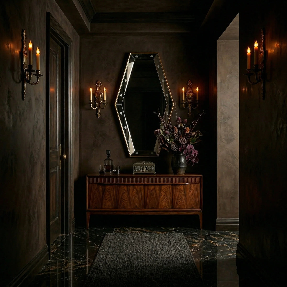 Ambella Home Key Hole wall mirror, 30W x 5D x 54H, geometric coffin-shaped mirror with antique gold edging displayed above a walnut credenza in a dark foyer