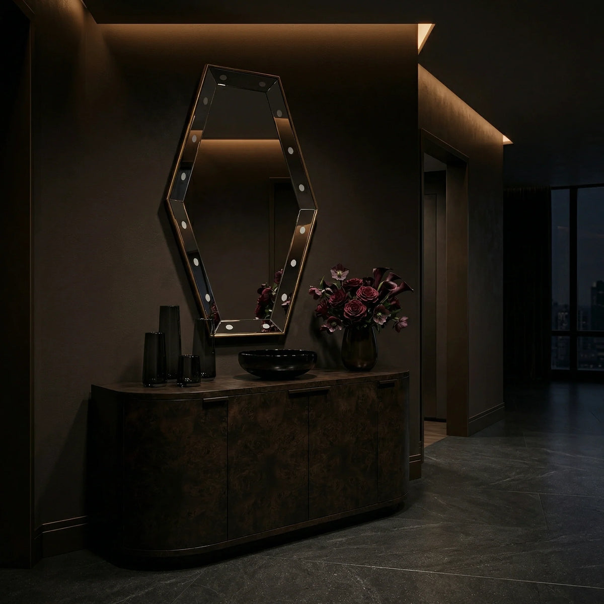 Faceted Key Hole Mirror by Ambella Home in antique gold, 30 inch geometric wall mirror mounted above a burl wood credenza in an elegant dark interior hallway