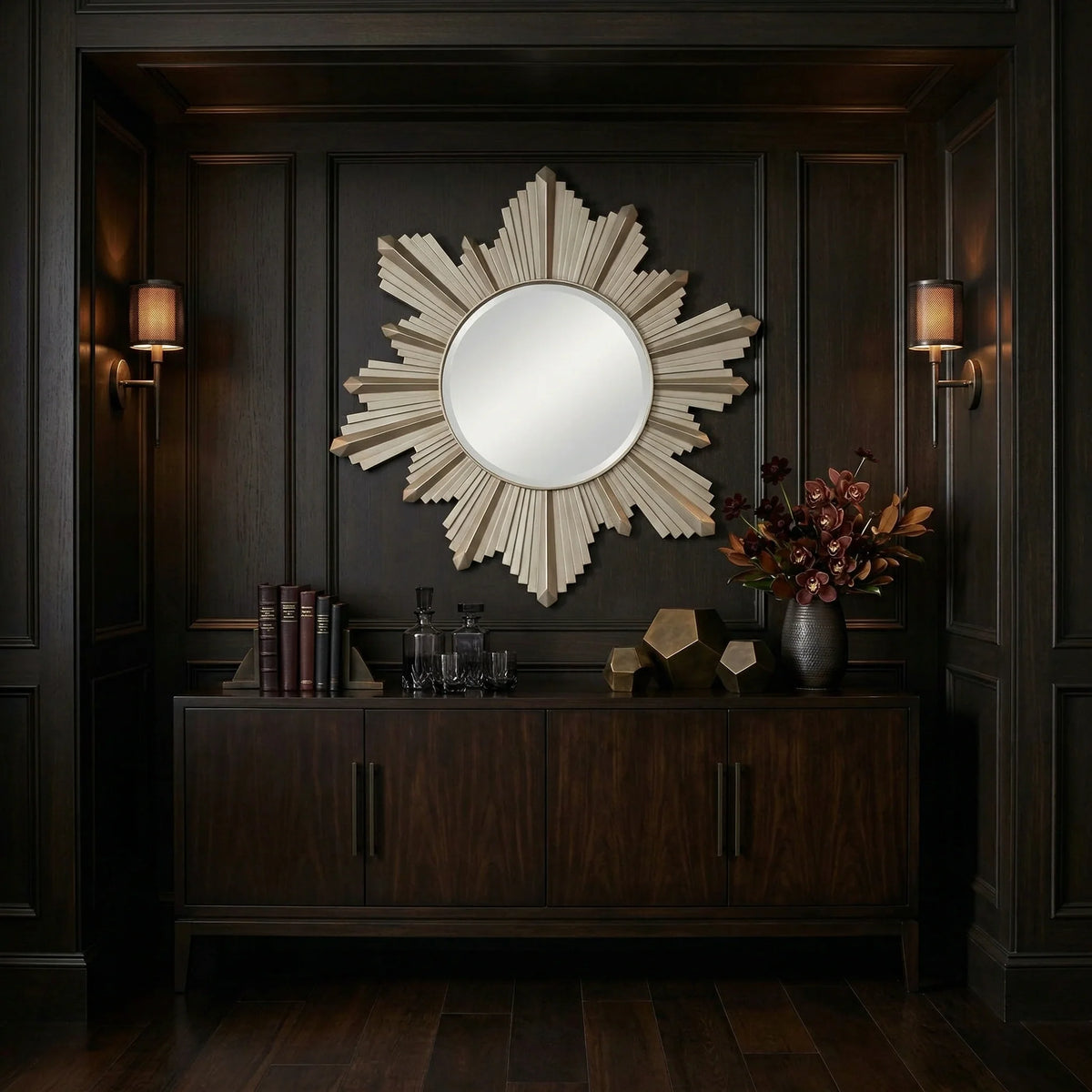37 inch Vassar Mirror by Ambella Home with champagne finish and sculptural sunburst design, styled above a walnut credenza in a dark entryway