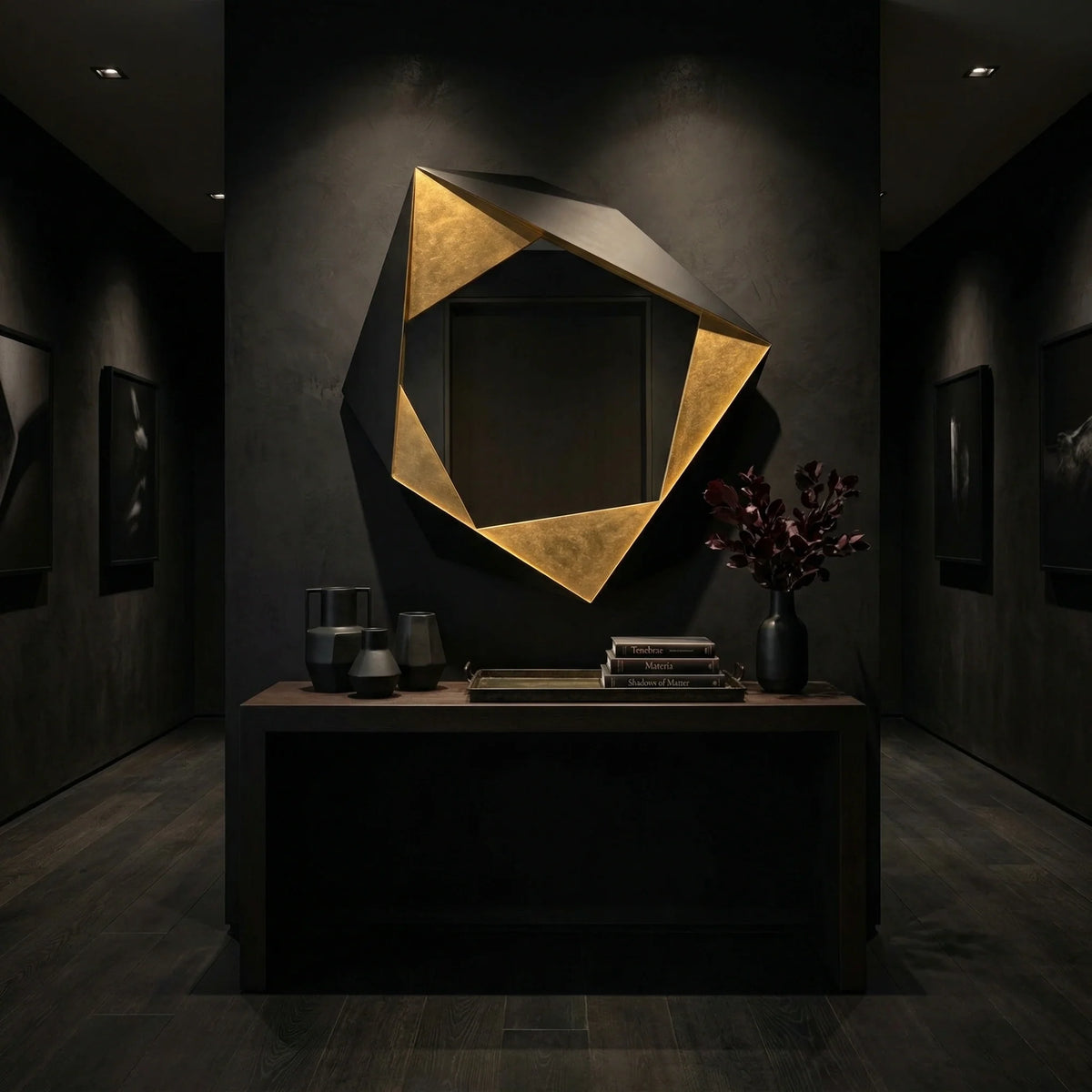 48 inch Folded Mirror by Ambella Home with faceted black and gold frame, styled above a dark console in a moody modern entryway