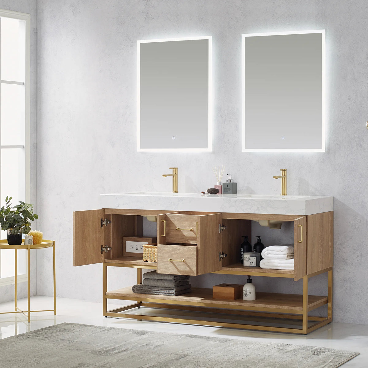 Linens and bottles stored in the open doors and drawers of the double vanity, with two mirrors above