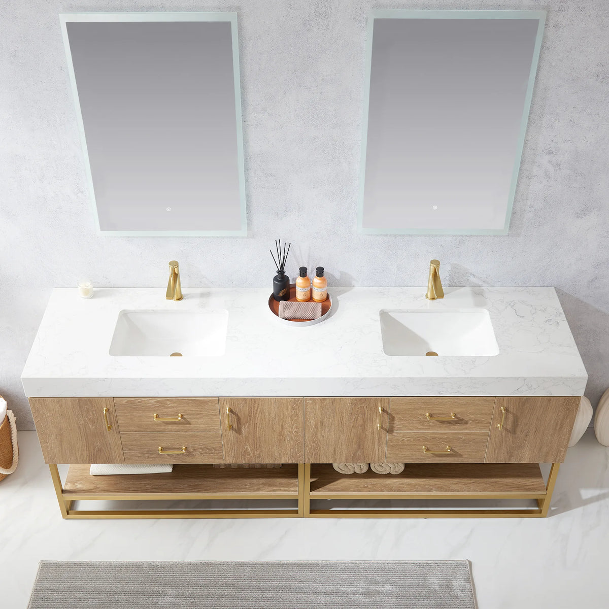 Overhead close-up of the white grain stone countertop and undermount ceramic sink area, with a decor tray