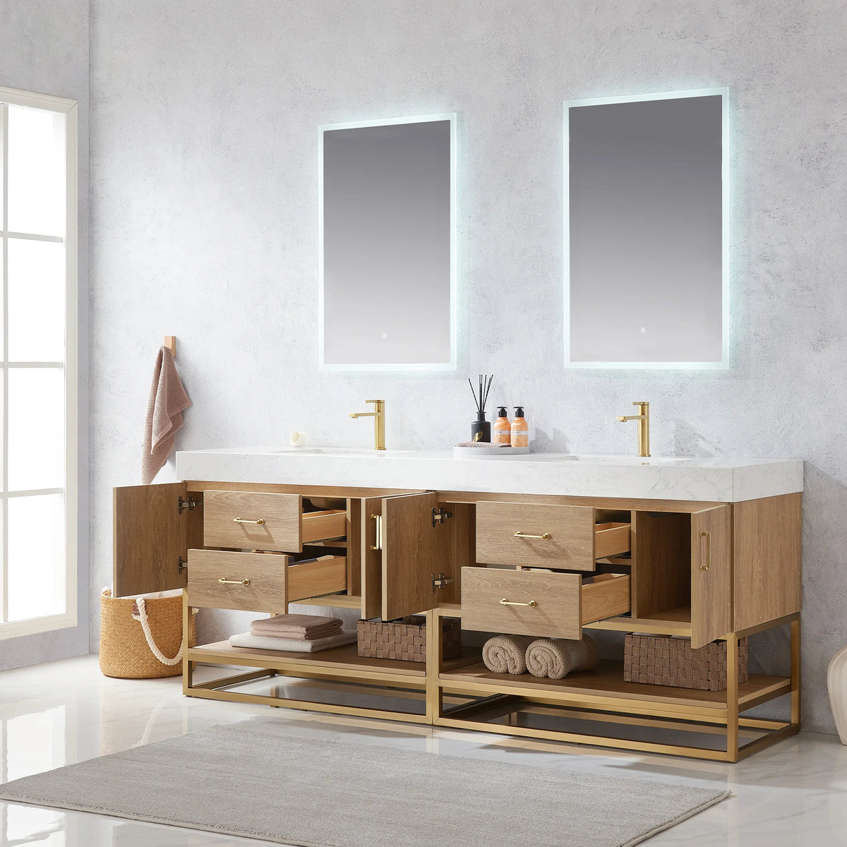 Room view of the double vanity with every door open and drawers extended, towels stored on the open shelf below