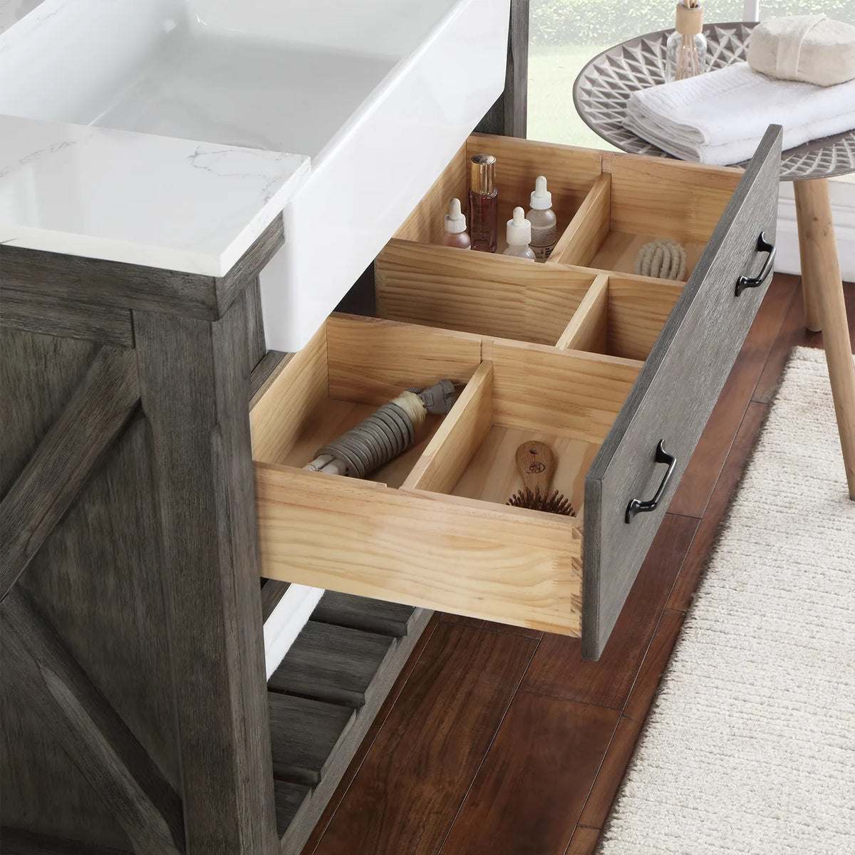 Drawer pulled forward to show its divided wood interior