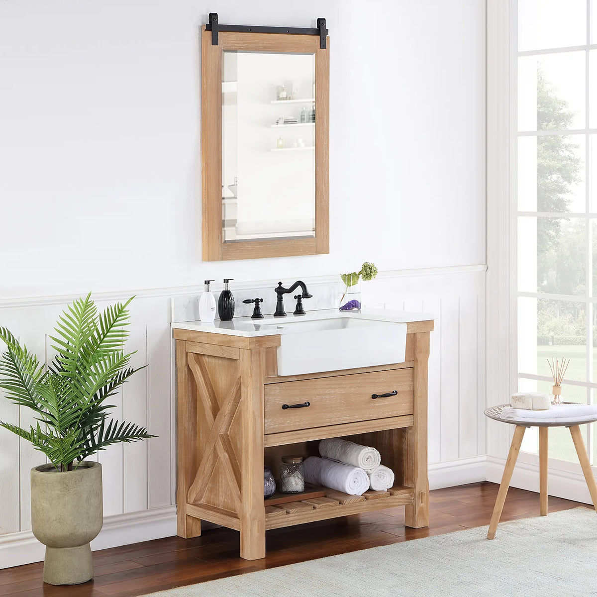Styled bathroom with vanity, mirror, plant and towels on the slatted open shelving