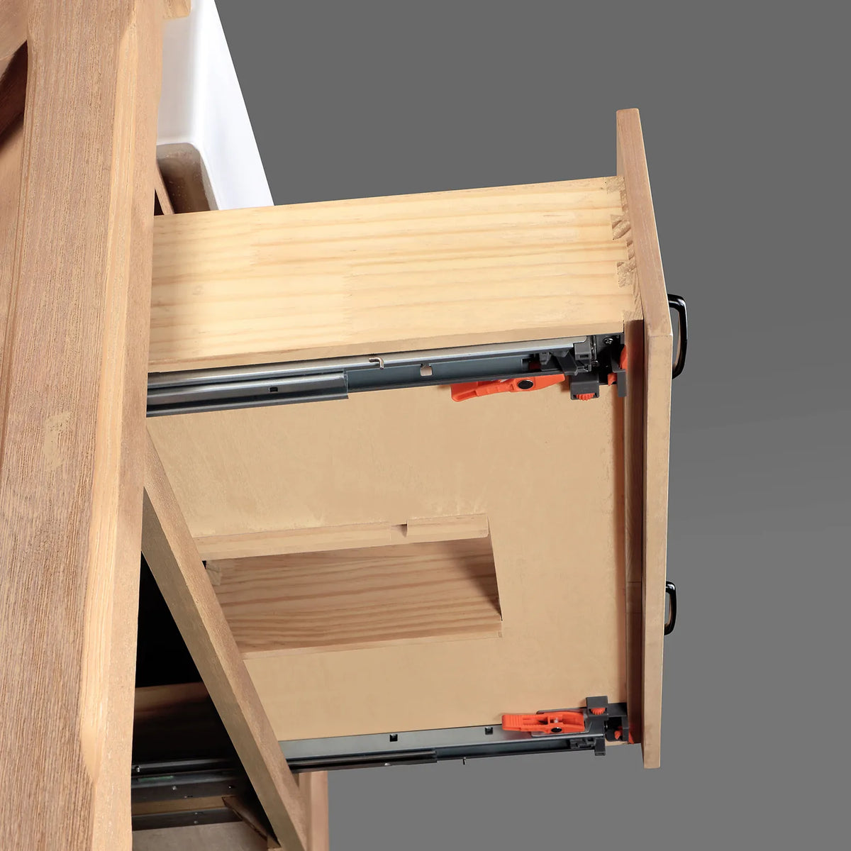 Full-extension drawer glide in close view with dovetailed wood box