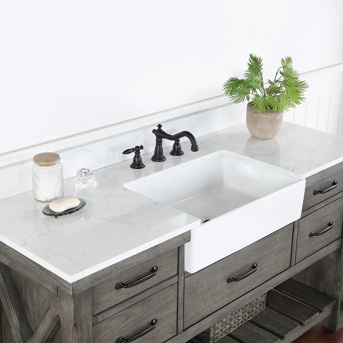 Angle across the white basin and backsplash with a black widespread faucet (sold separately)