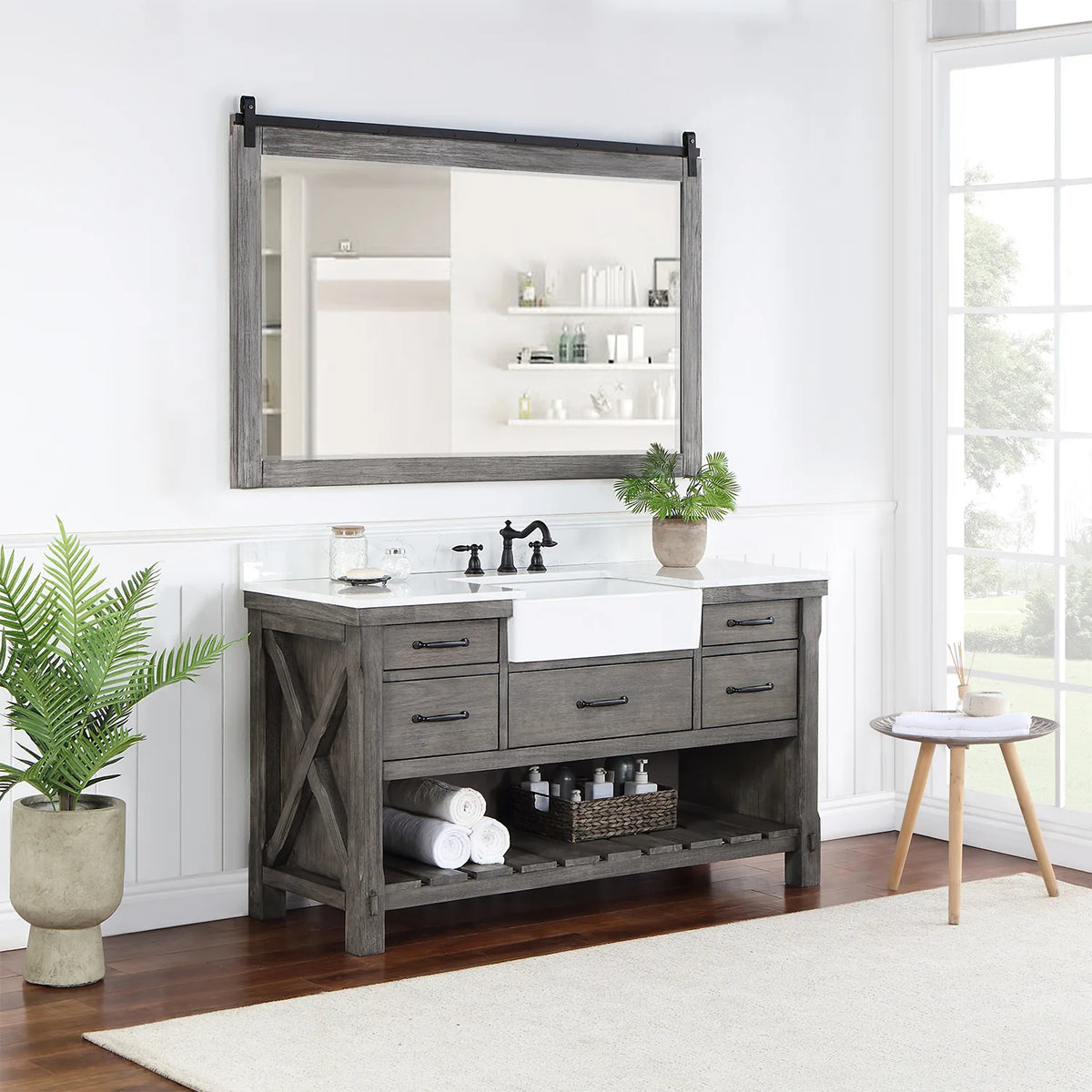 Styled bathroom with vanity, mirror, plant and towels on the slatted open shelving