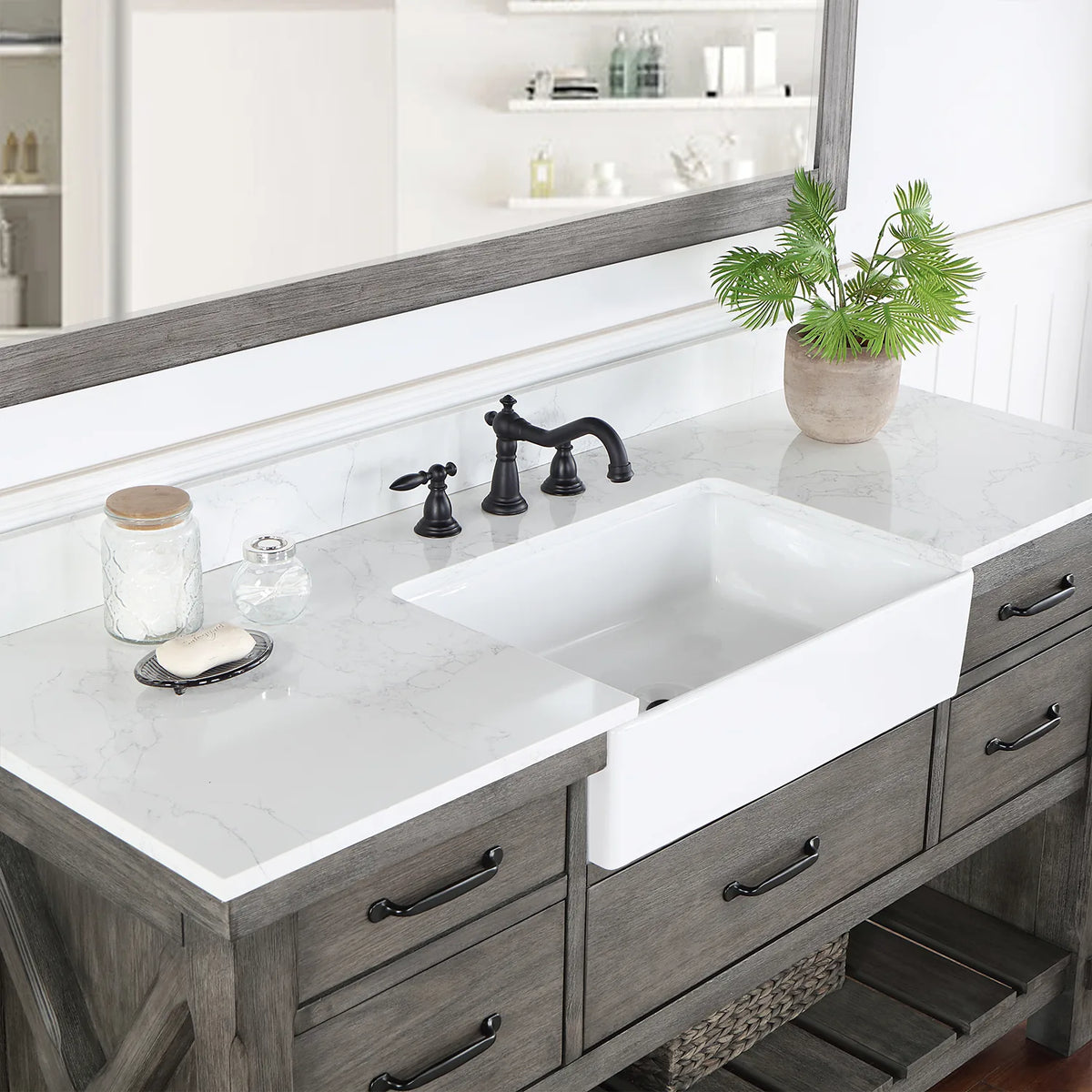Deep white basin set into the stone top, seen from the side with the faucet