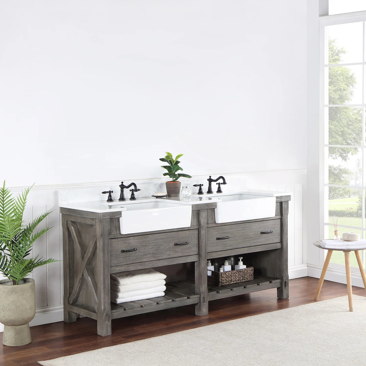 Vanity seen from a distance at an angle, window light and plant beside it