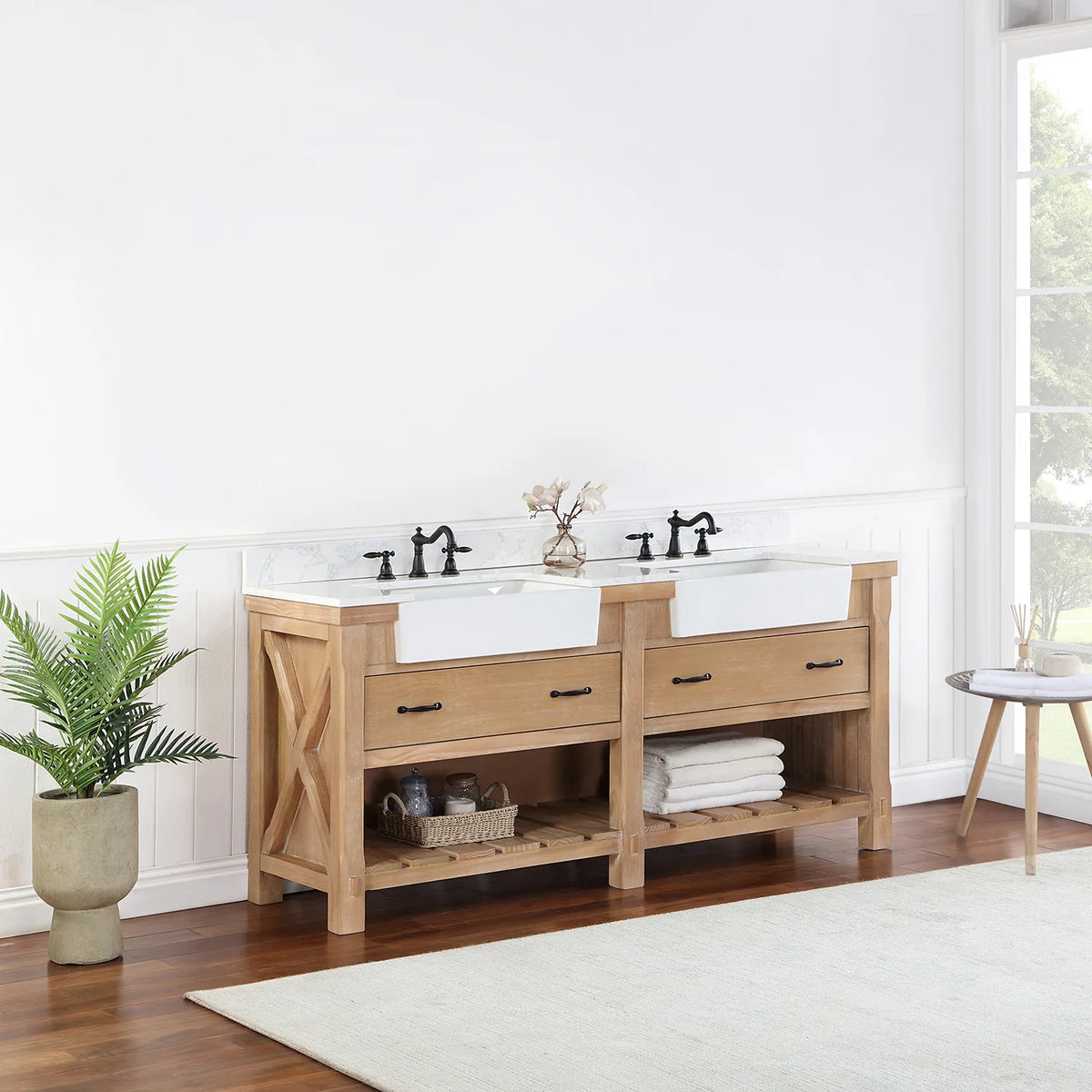 Vanity seen from a distance at an angle, window light and plant beside it