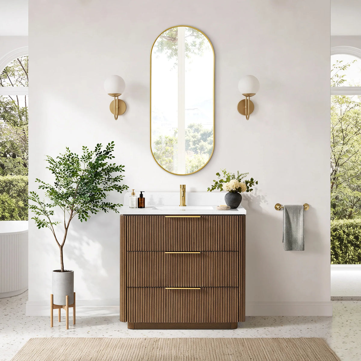 Room view, front: single sink vanity staged beside a white wall and a potted plant