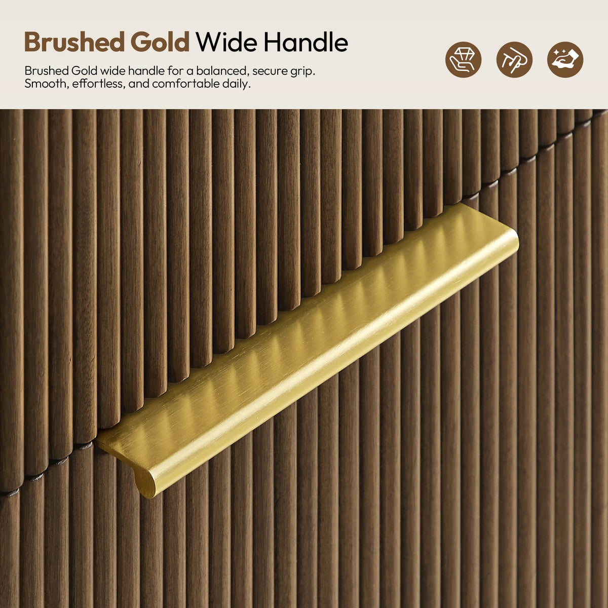 Close-up of a brushed gold wide pull on the drawer front
