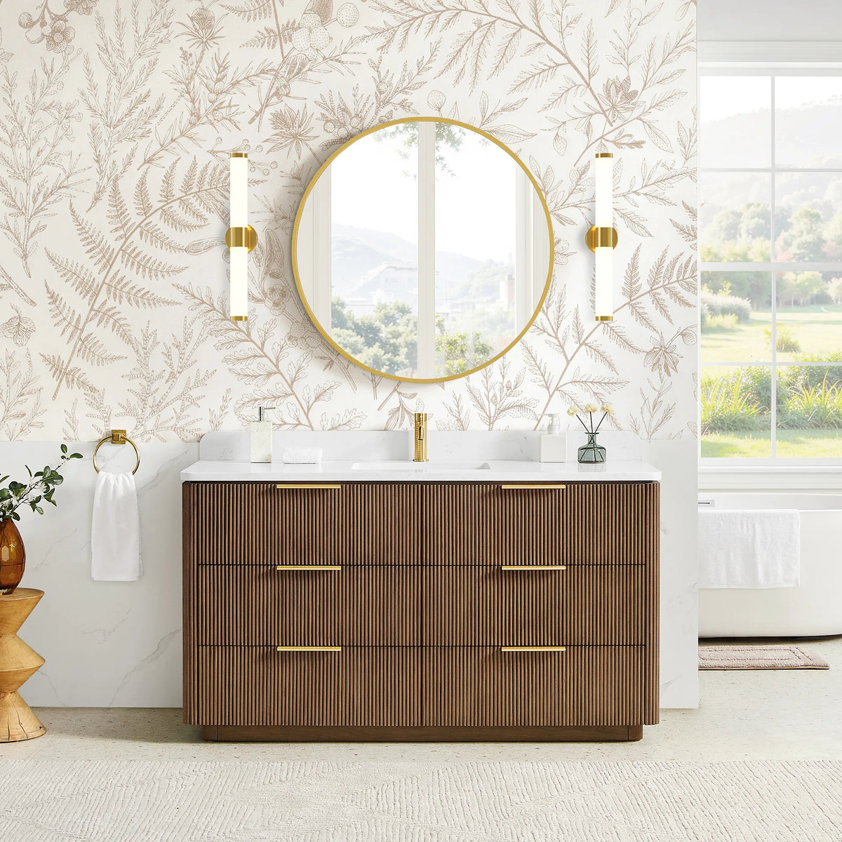 Room view, front: single sink vanity staged beside botanical leaf wallpaper