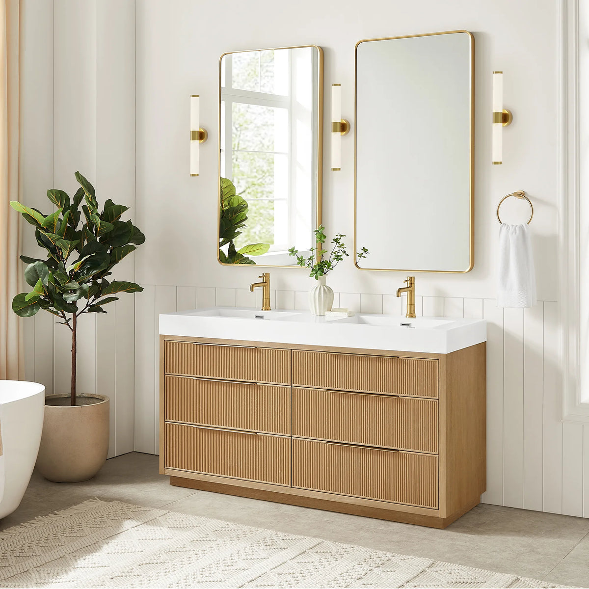 Bath scene for the 60-inch double vanity with its two matching mirrors and gold wall sconces, plus a tall potted plant