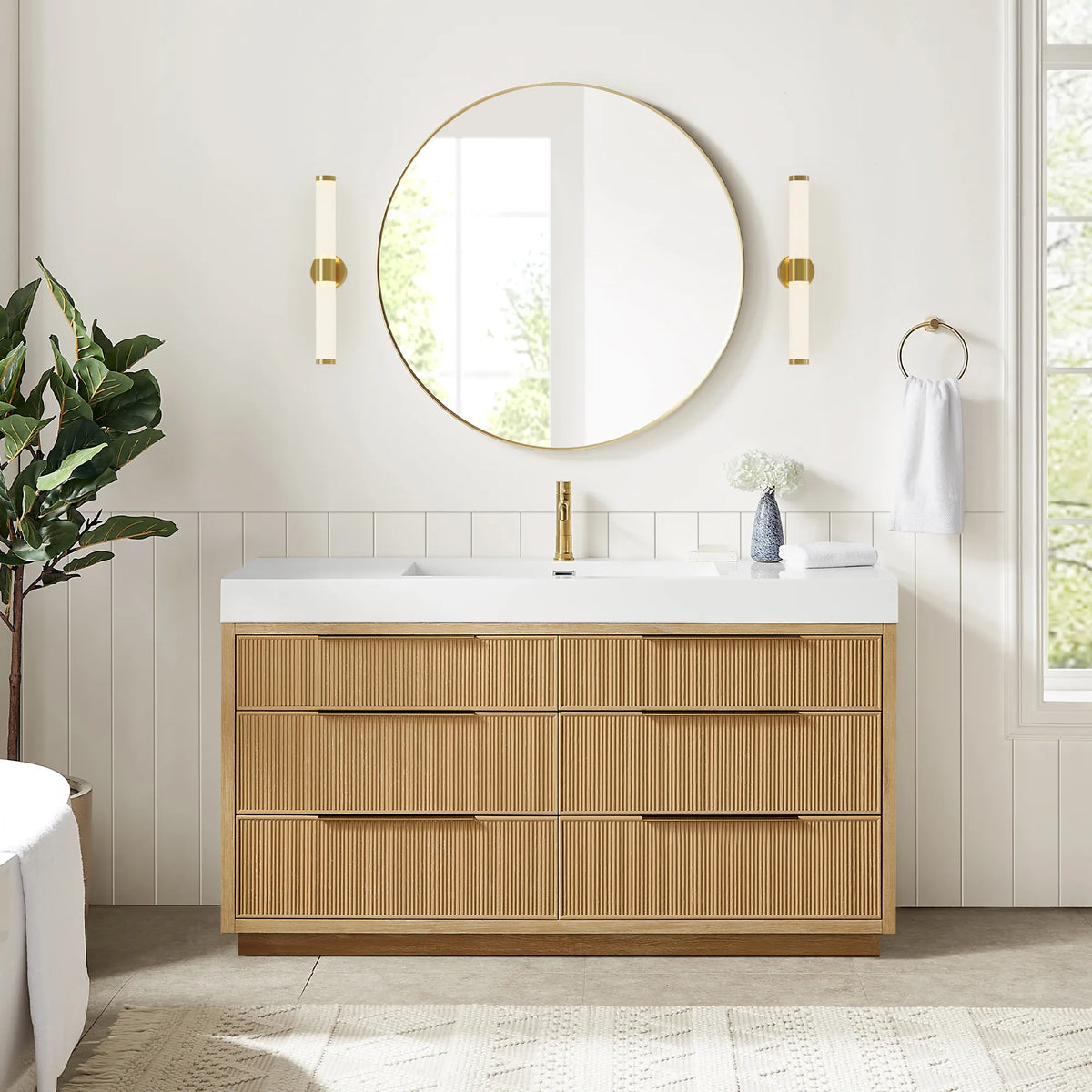 Wide room view of the 60-inch single vanity with six drawer fronts, a circular gold mirror and a glimpse of a tub