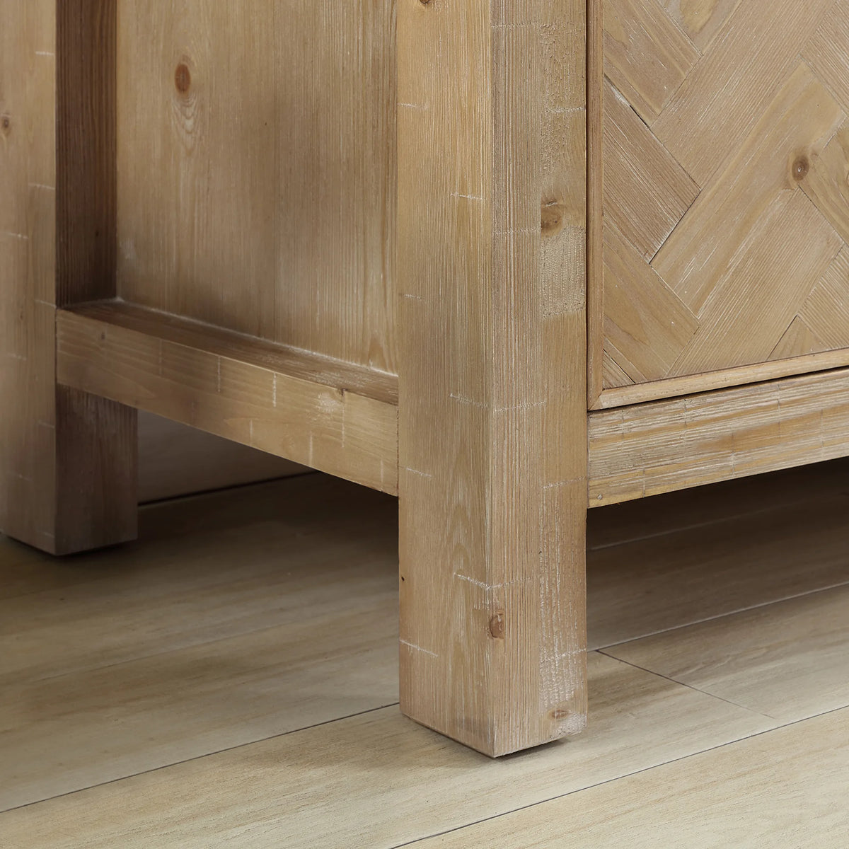 Detail of the solid wood frame and leg at the bottom corner of the 48 inch vanity