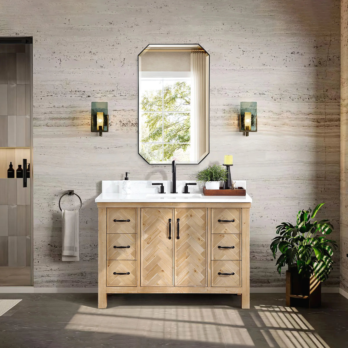 Spruce Antique Brown single vanity in a neutral bathroom with an octagon mirror, wall lights and a plant
