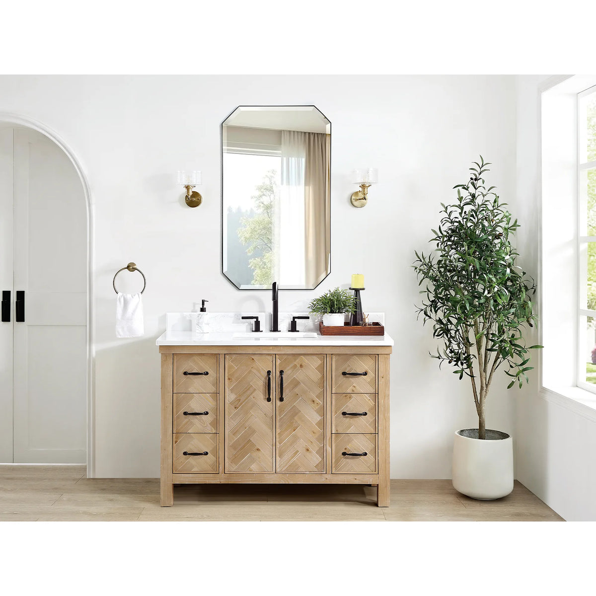 Bright bathroom corner with the 48 inch Spruce Antique Brown vanity, an octagon mirror and a plant