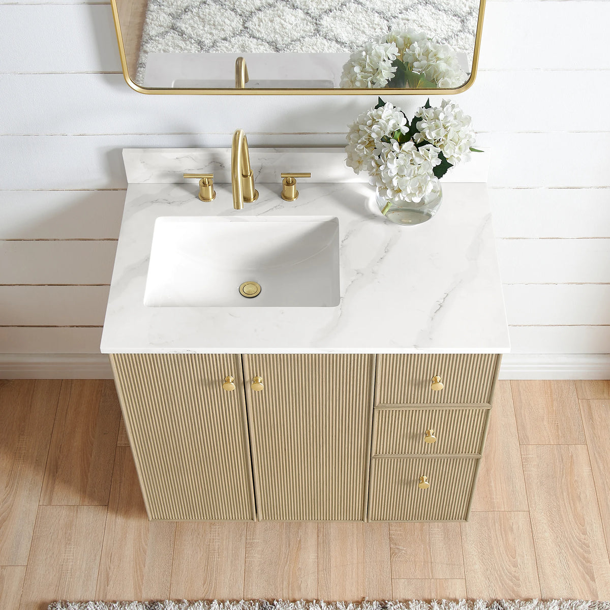 Close view from above of the Calacatta White Quartz top and undermount ceramic sink