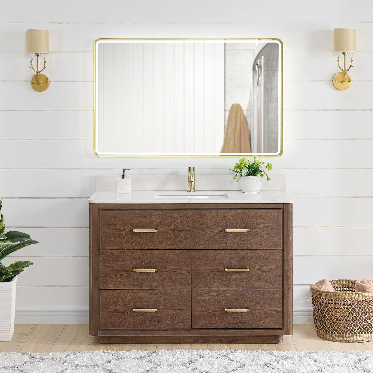 48 inch single vanity in Aged Dark Brown Oak with an LED mirror, shown in a bathroom with gold wall sconces