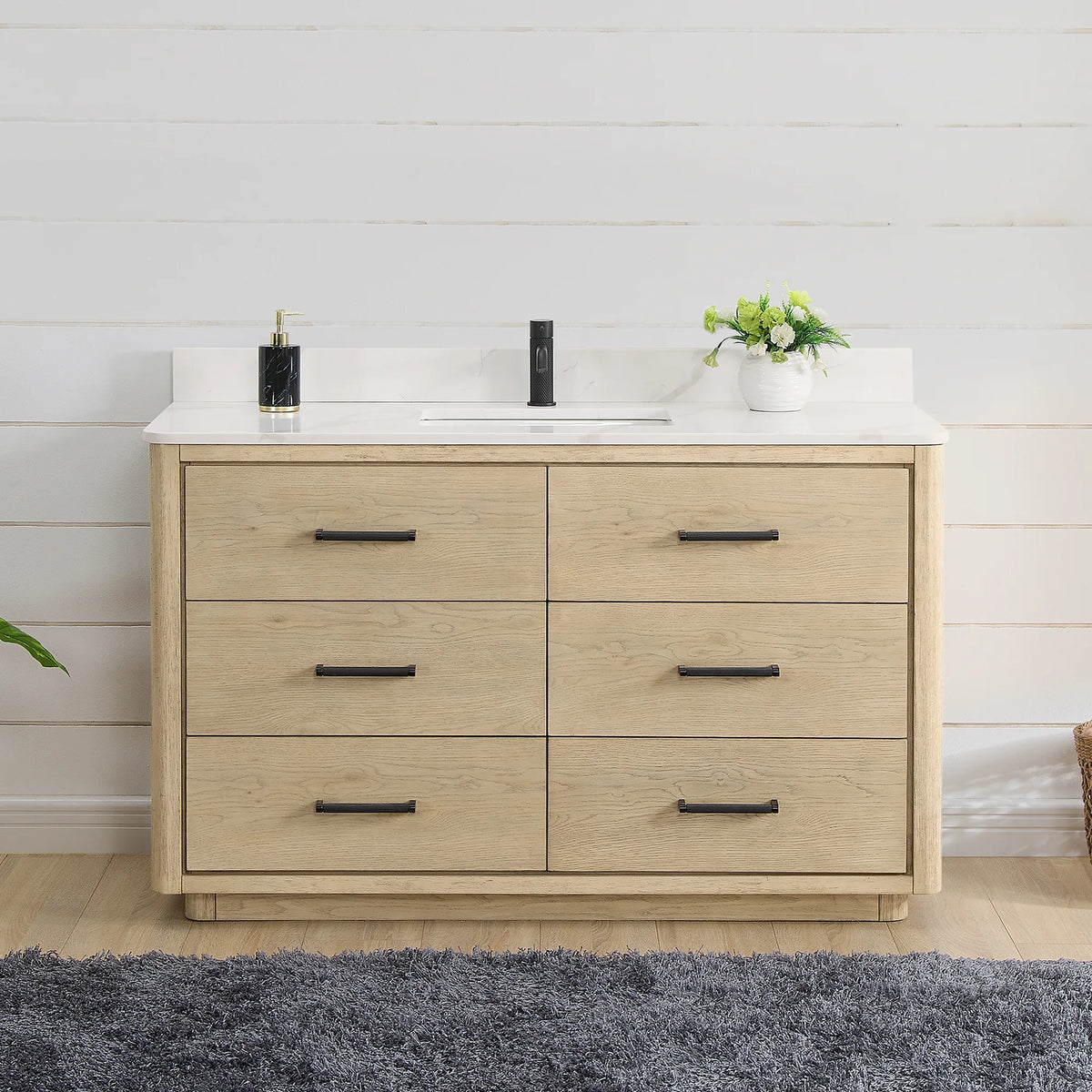 Aged Natural Oak single vanity, 55 inch, staged in a bright bathroom with a shiplap wall and a grey rug