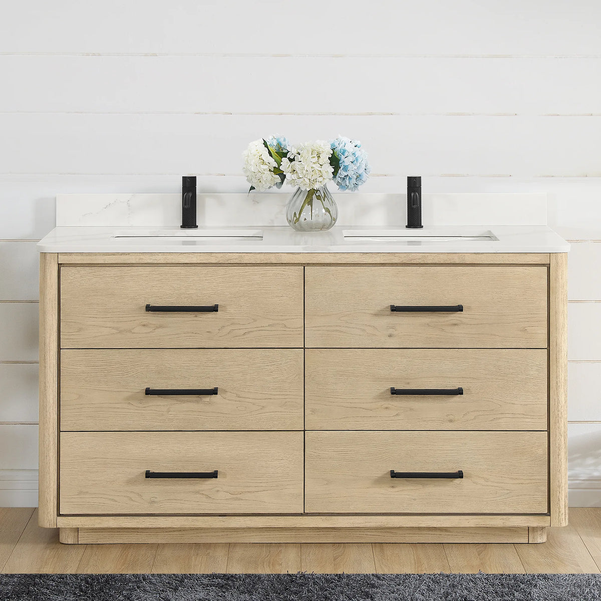 Front view of a 60 inch double vanity in Aged Natural Oak, styled in a shiplap bathroom with matte black hardware