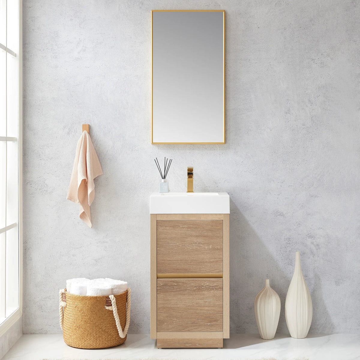 Wide shot of the vanity with mirror beside a window, towel hook, woven basket and white vases