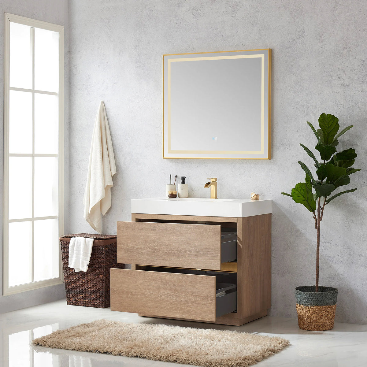 Vanity with mirror above and drawers open, window, hamper and plant in the room