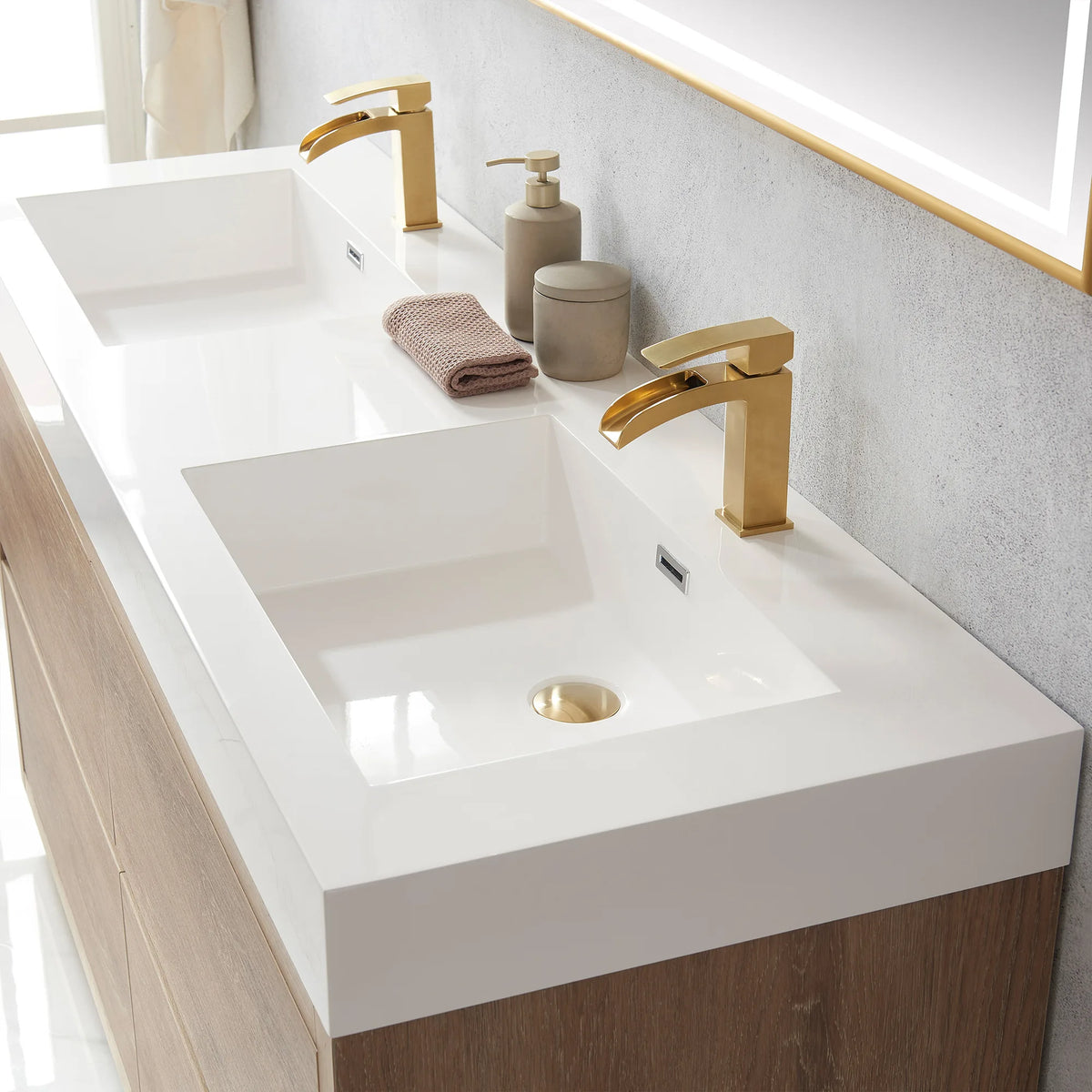 Detail of the double sink top with jars and folded towel, mirror frame at upper right
