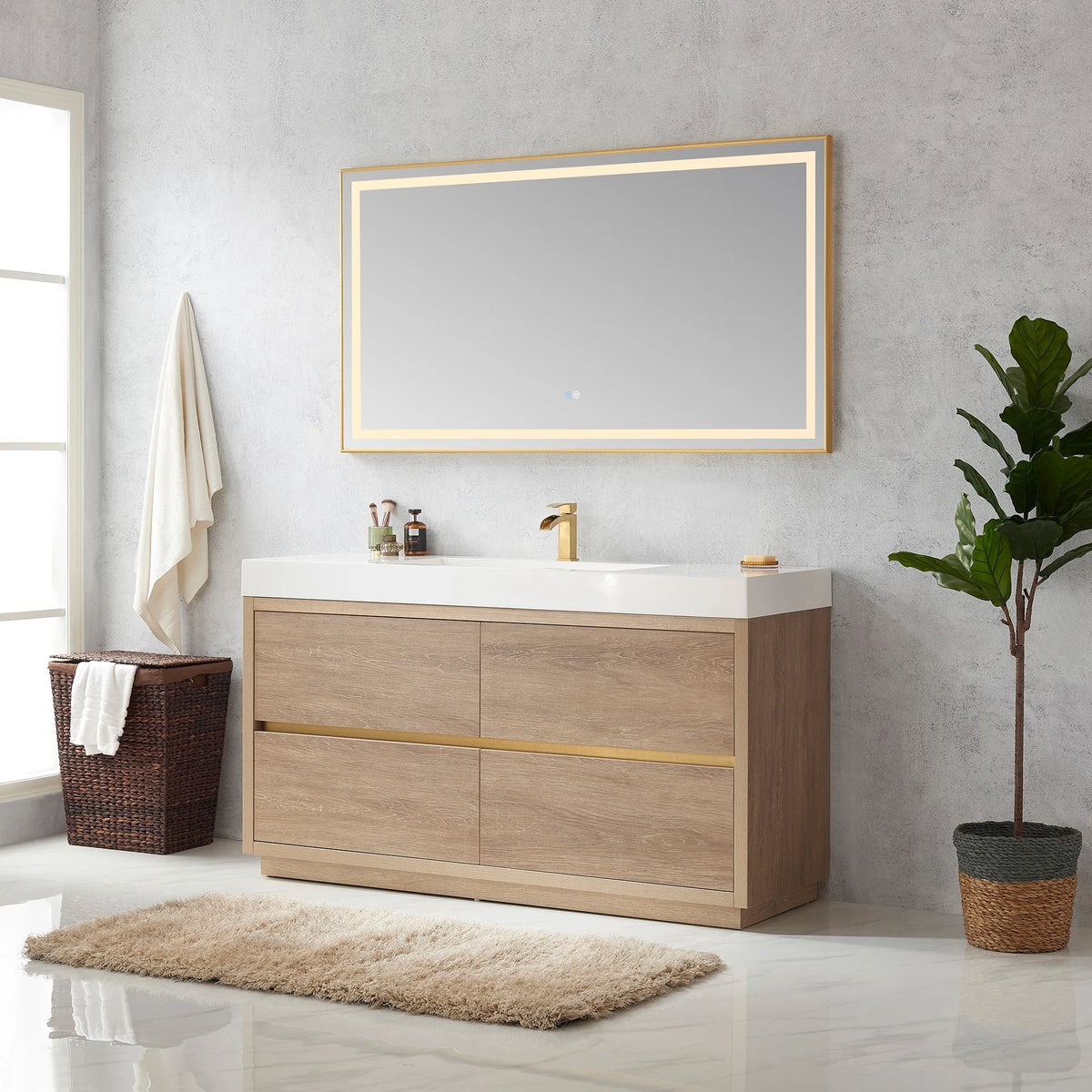 Wide room view of the vanity with LED mirror, towel on a hook, hamper, plant and shag rug