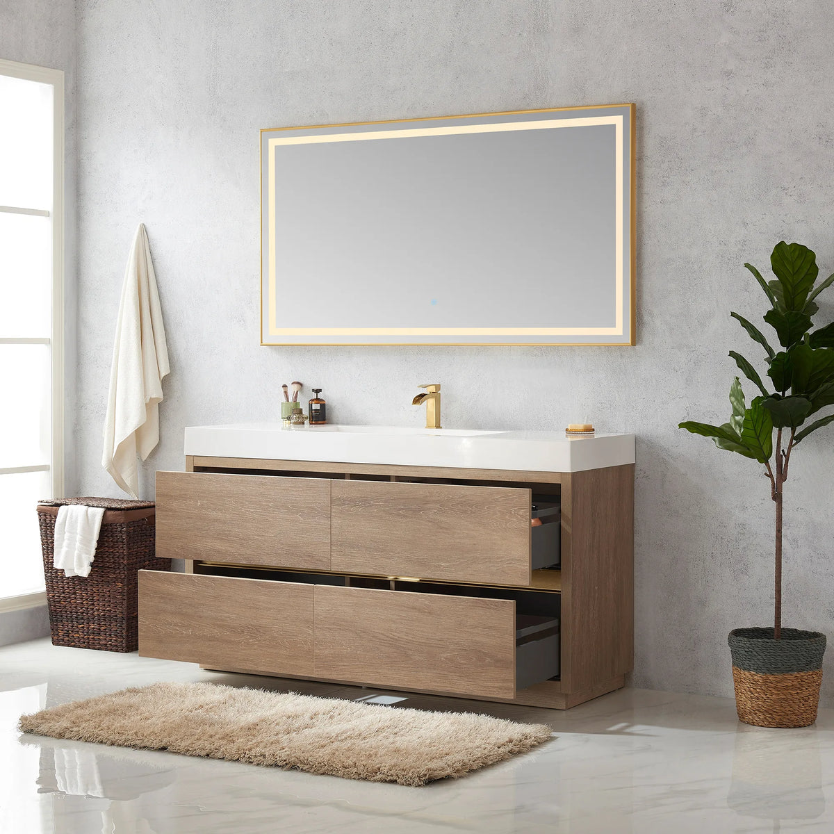 Vanity with drawers pulled open showing gray drawer interiors, mirror above, hamper and plant