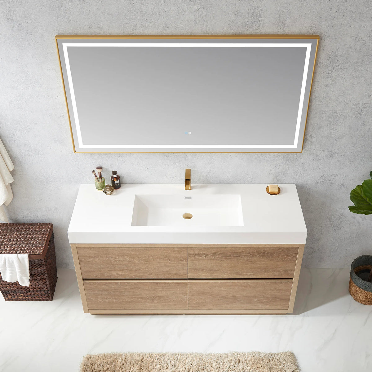 High-angle view of the vanity with LED mirror above, white integrated sink, soap dish on top