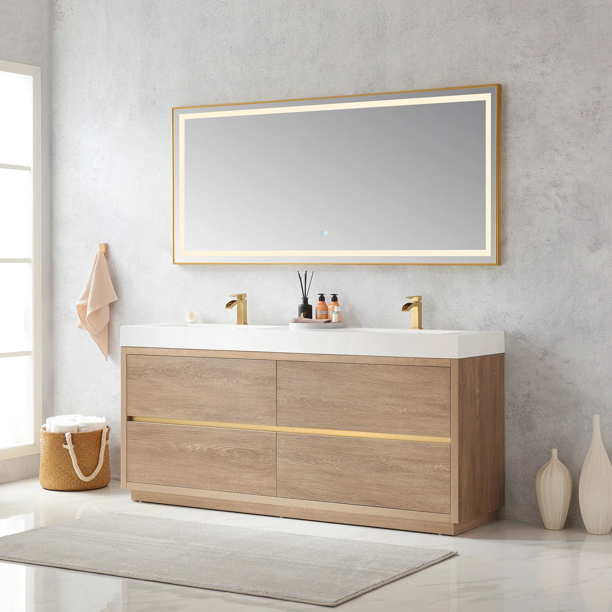 Angled wide shot of the double vanity with mirror, window at left, basket of towels and vases