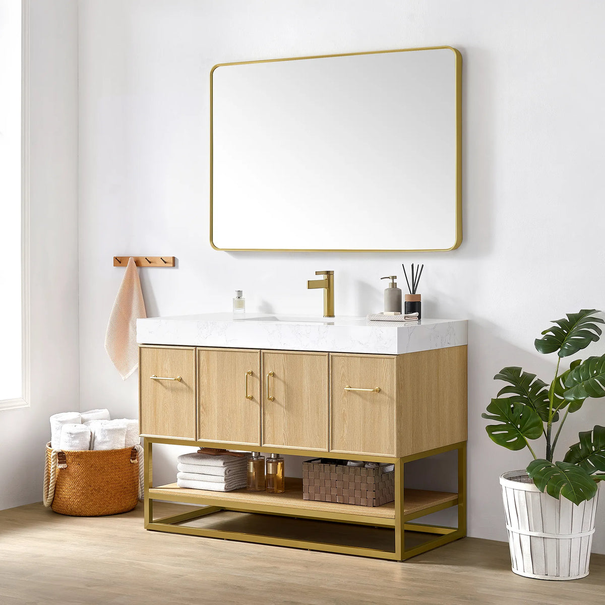 Close room view of the 48 inch Dark Oak single vanity with a brushed gold wall mirror above and baskets on the shelf