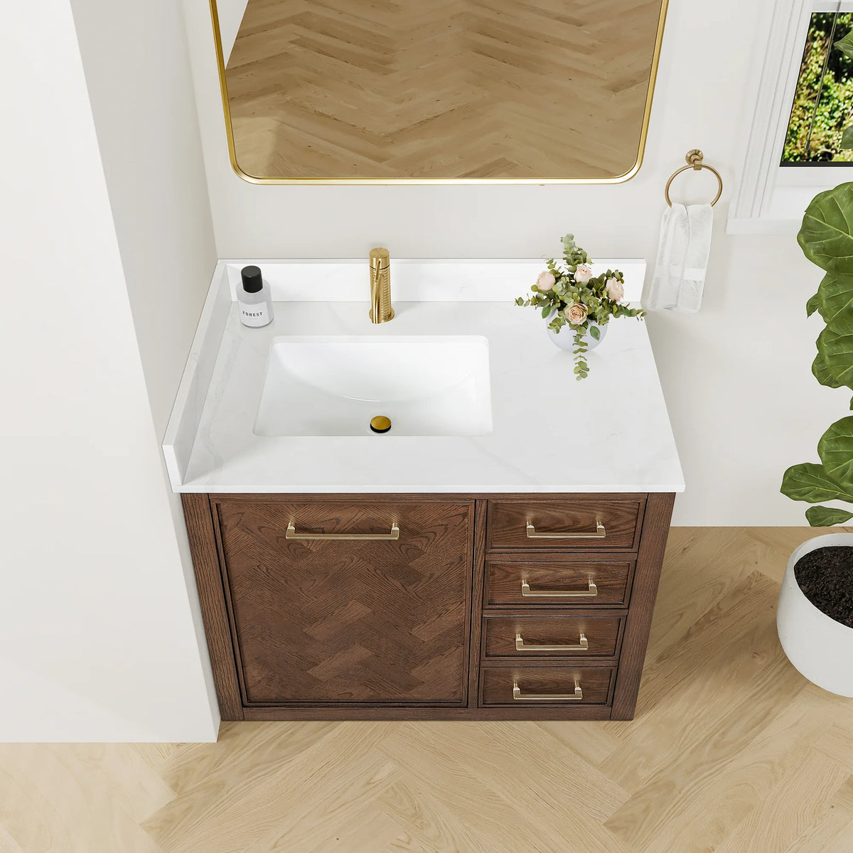 High view of the 36-inch single vanity, white-veined top and backsplash around a rectangular sink, wood floor below