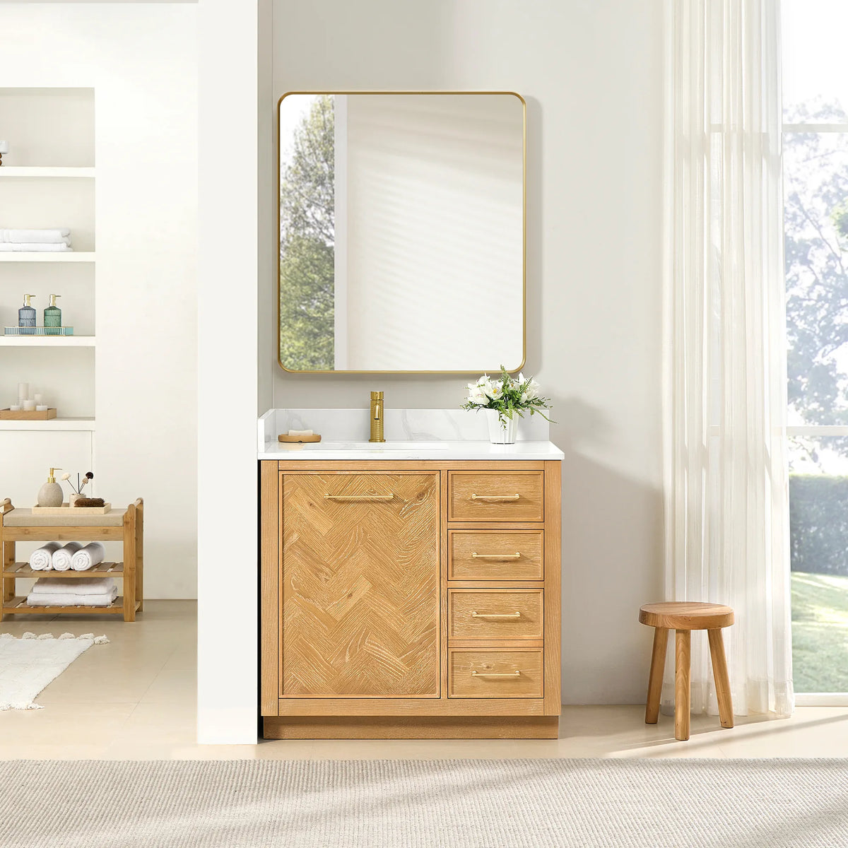 Bathroom scene with the 36-inch single vanity, its matching mirror and a flower arrangement, plus a low wood stool