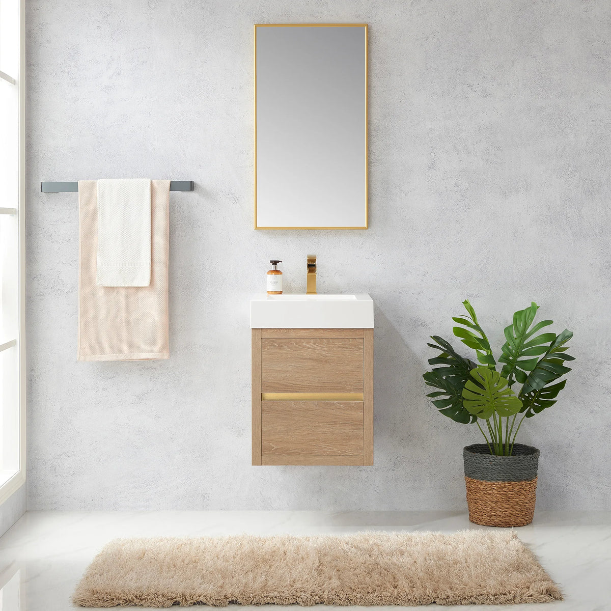 Small floating vanity in North American Oak under a rectangular framed mirror in a light, airy bathroom