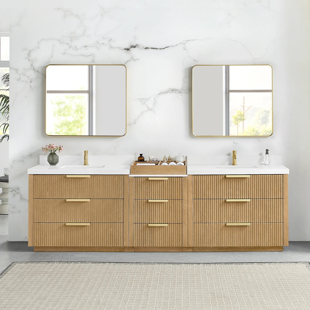 Two brushed gold wall mirrors above the 108 inch Washed Ash Grey double vanity, nine drawers and a center storage box