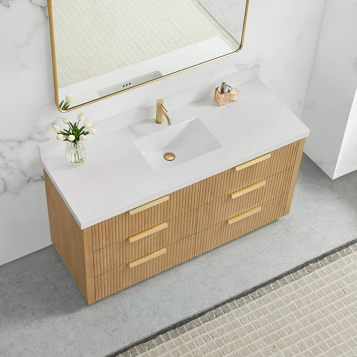 Quartz top seen from a high corner on the 60 inch Washed Ash Grey single vanity, brushed gold handles below