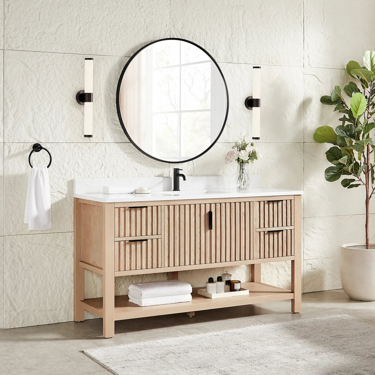 Second angle: the 60-inch Aged Natural Oak vanity with a matching circular black mirror, wall sconces and a plant
