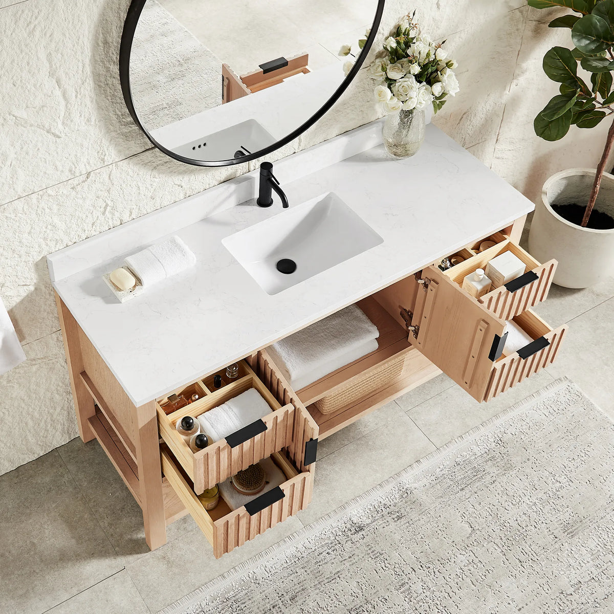 Inside storage in a staged room: doors and drawers open on the 60-inch Aged Natural Oak cabinet