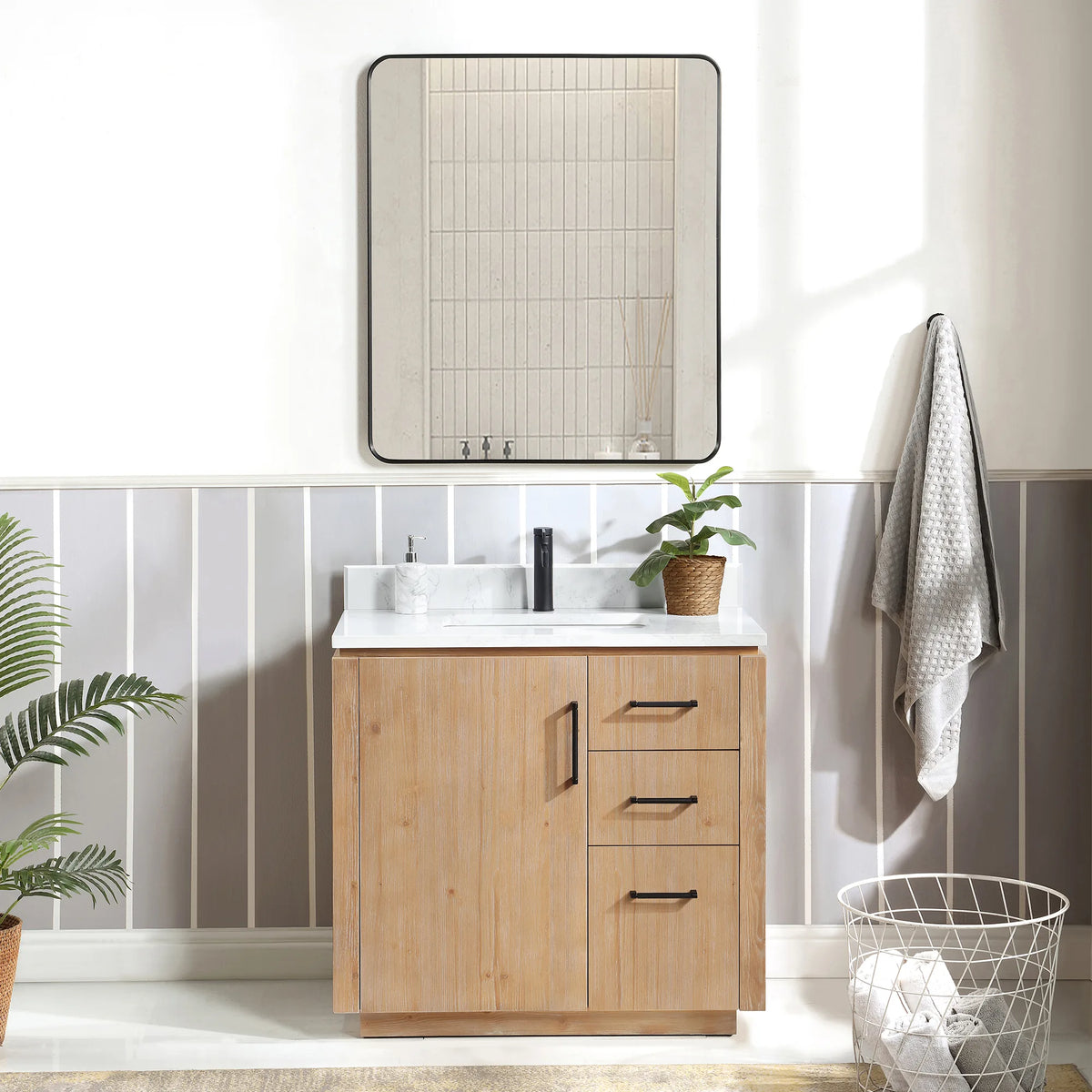 Bathroom scene with a 36 inch Fir Wood Brown vanity, framed mirror, hanging towel and wire basket