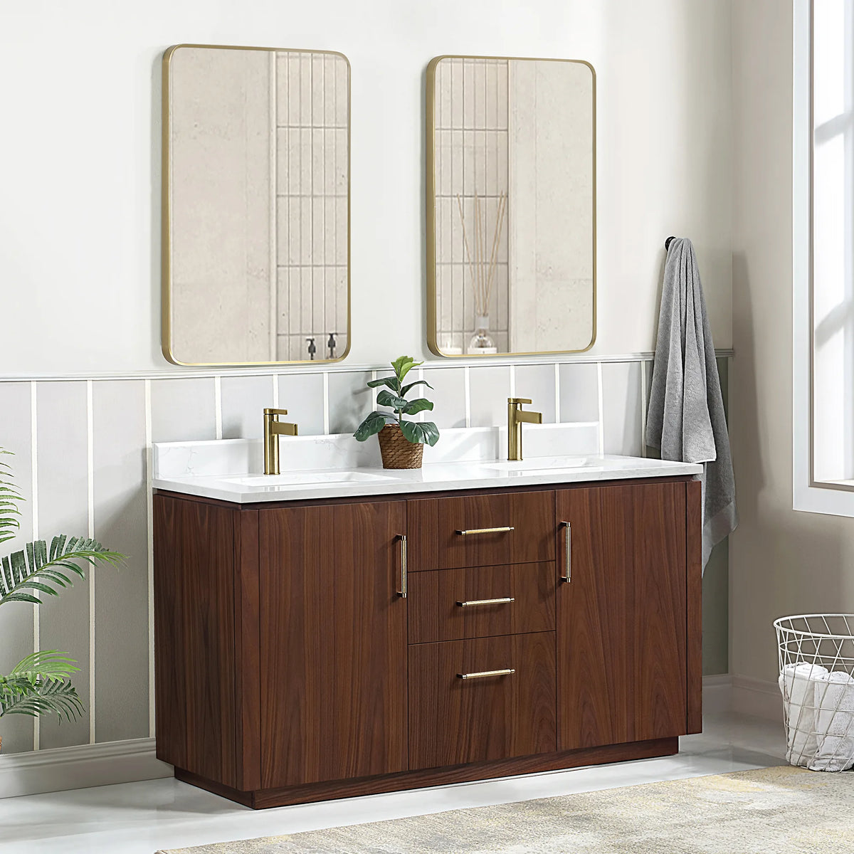 Corner room scene of the double vanity with mirrors, a grey towel hanging at the right