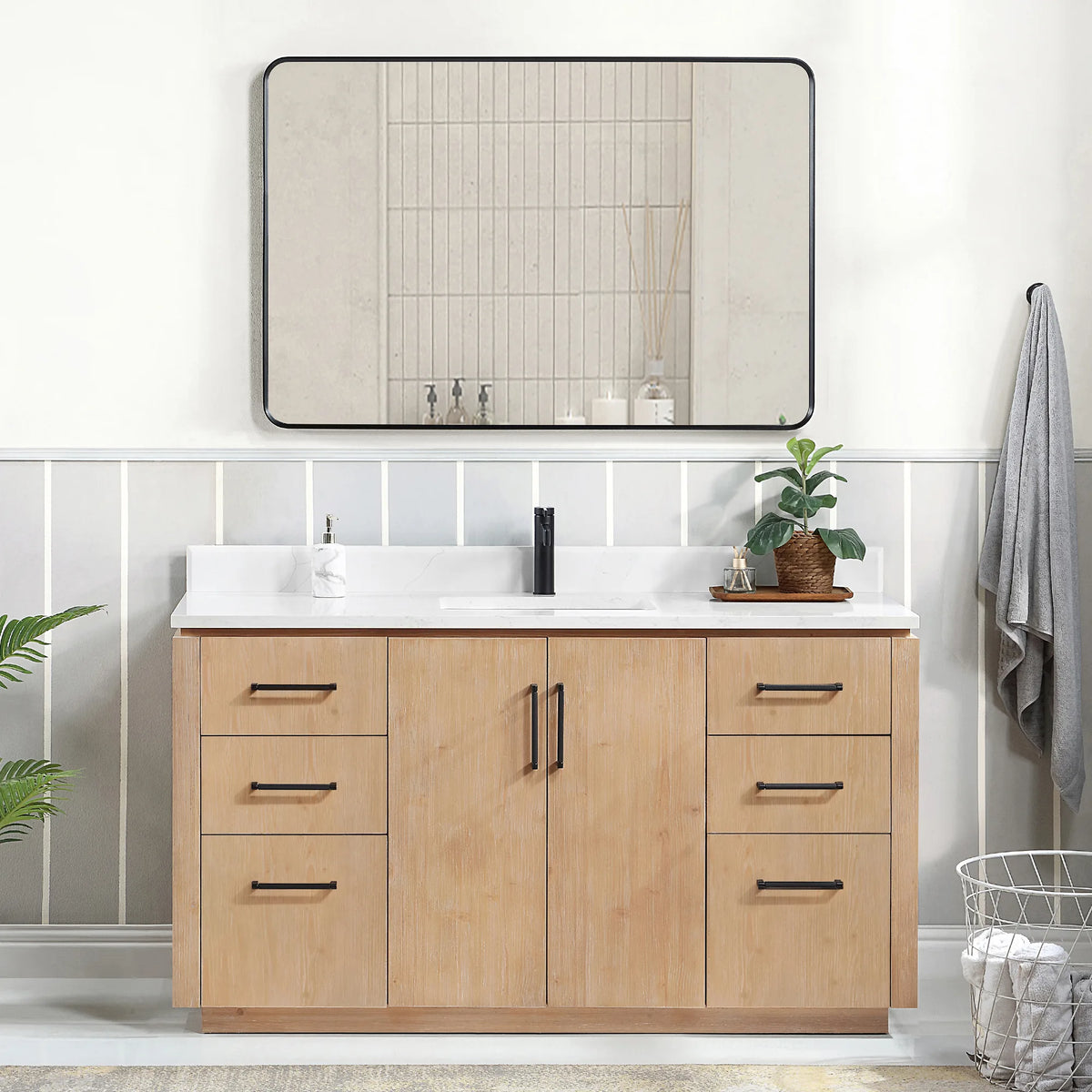 Bathroom scene with a 60 inch Fir Wood Brown vanity, a wide mirror, hanging towel and laundry basket