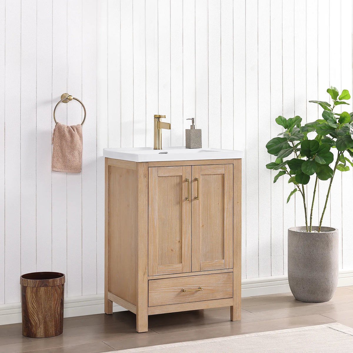 Three-quarter bathroom view of the vanity with a towel ring and wastebasket