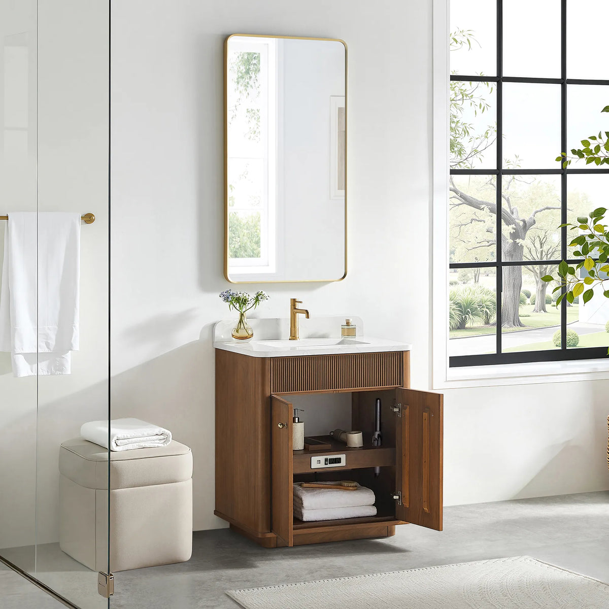 Open storage on the Natural Walnut vanity: doors swung back and towels stacked on the shelf