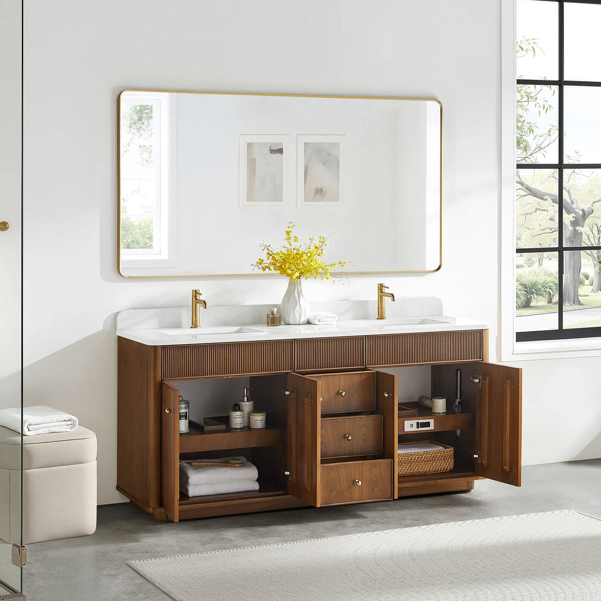 Natural Walnut double vanity in a bathroom with doors and drawers open, towels folded on the shelves inside