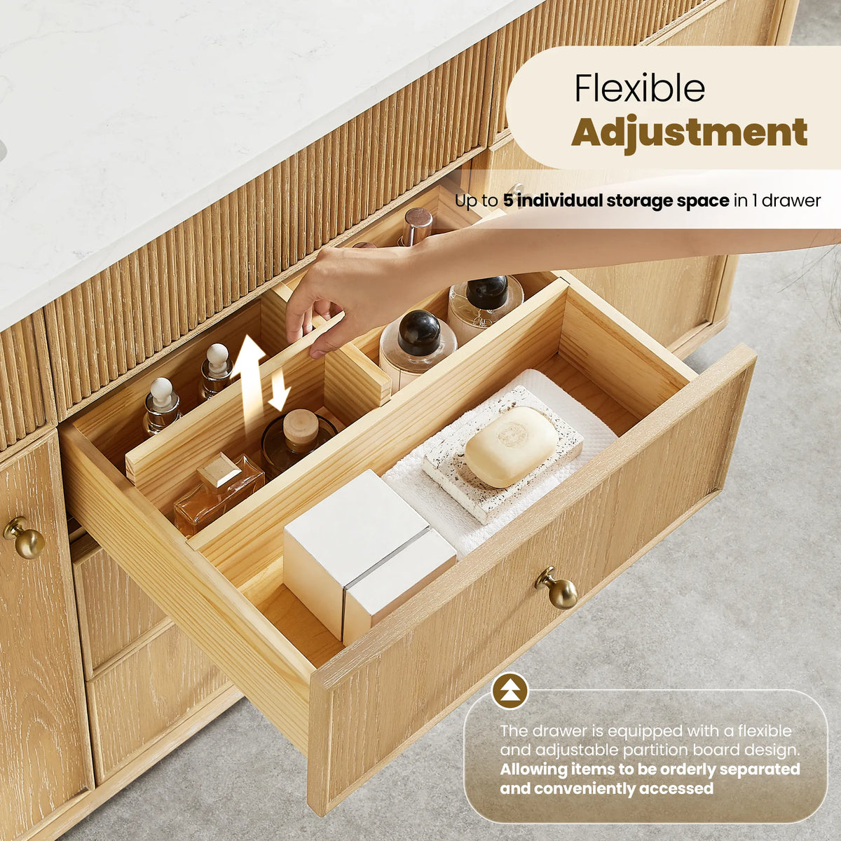 Open drawer on the Washed Ash Grey vanity with partition storage holding bottles, soap and small jars